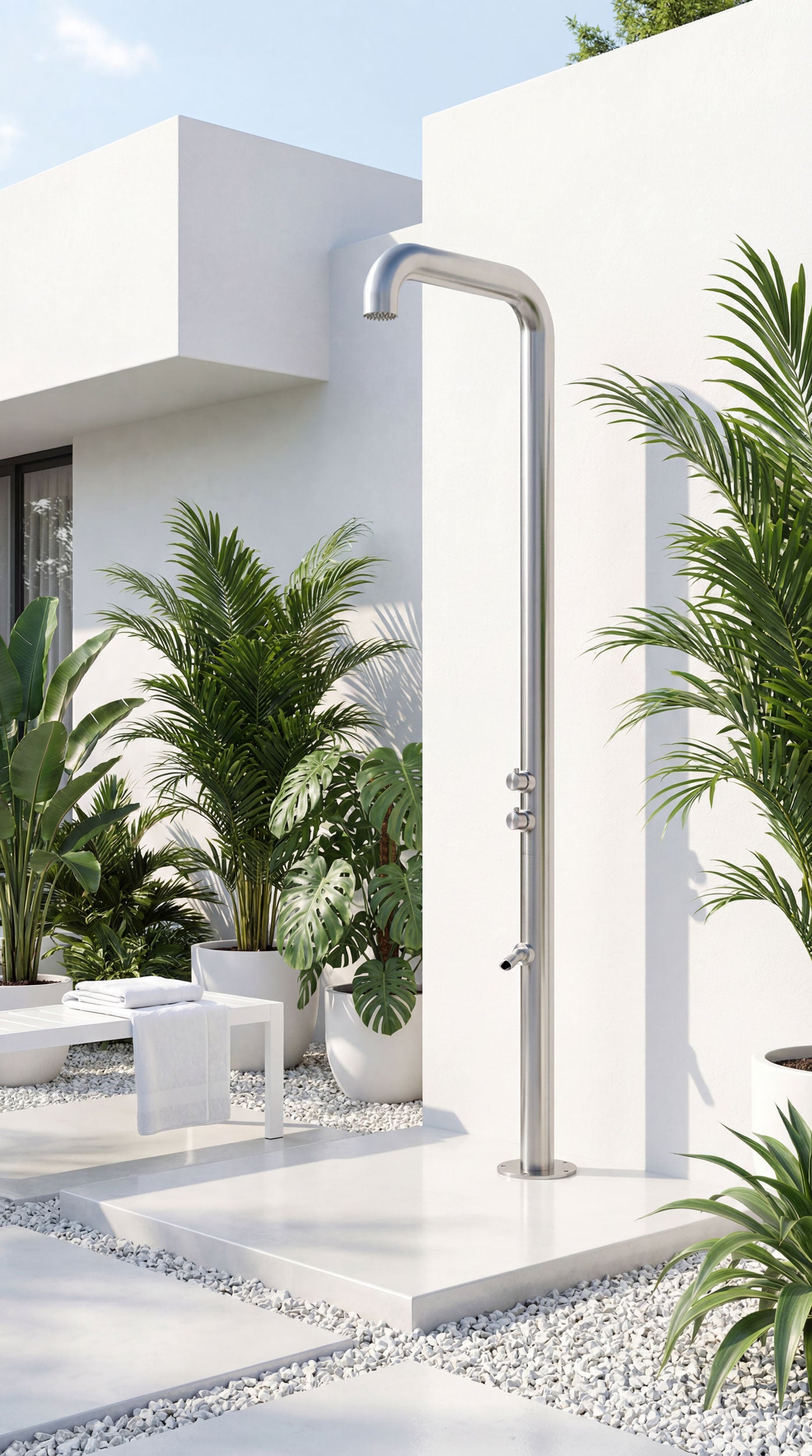 TherapySpa OS-16 outdoor shower with a white building and palm trees in the background